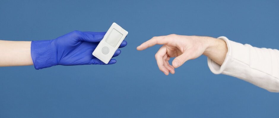 person s hand in latex gloves holding a glucometer