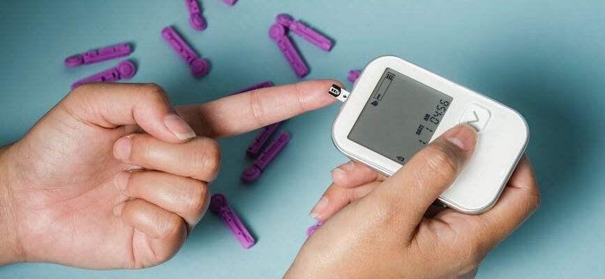woman checking blood sugar with glucometer